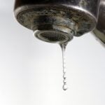 Dripping tap with limescale