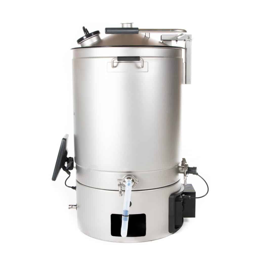 Industrial stainless steel pressure vessel with lid, handles and attached tubing in a lab setting