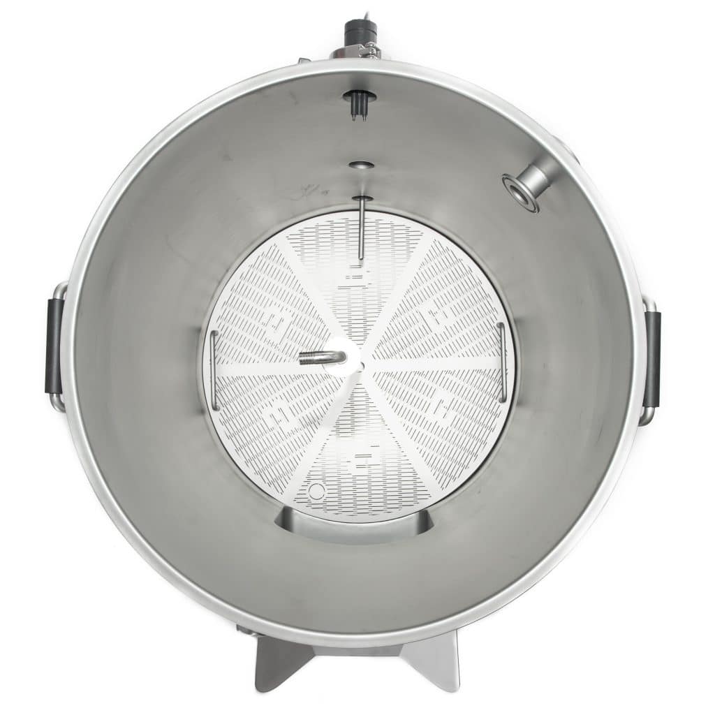 Top view of a large stainless steel drum with a perforated inner basket and mounting legs showing at the edges.