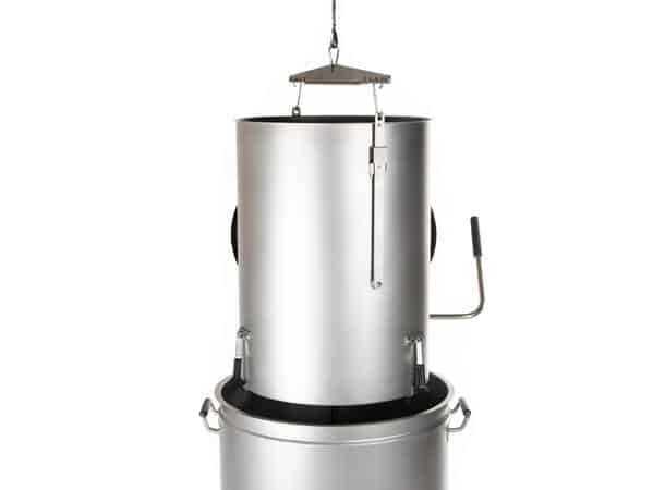 Vertical stainless steel smoker with a drum-style base and a lifted lid, featuring side handles and a hanging mechanism